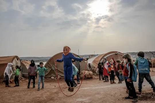 Refugee Children in Syria, girl skipping rope